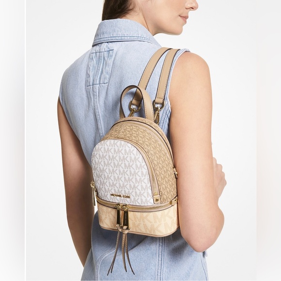 29. Michael Kors Signature Rhea Zip XS Backpack - Picture 5 of 10